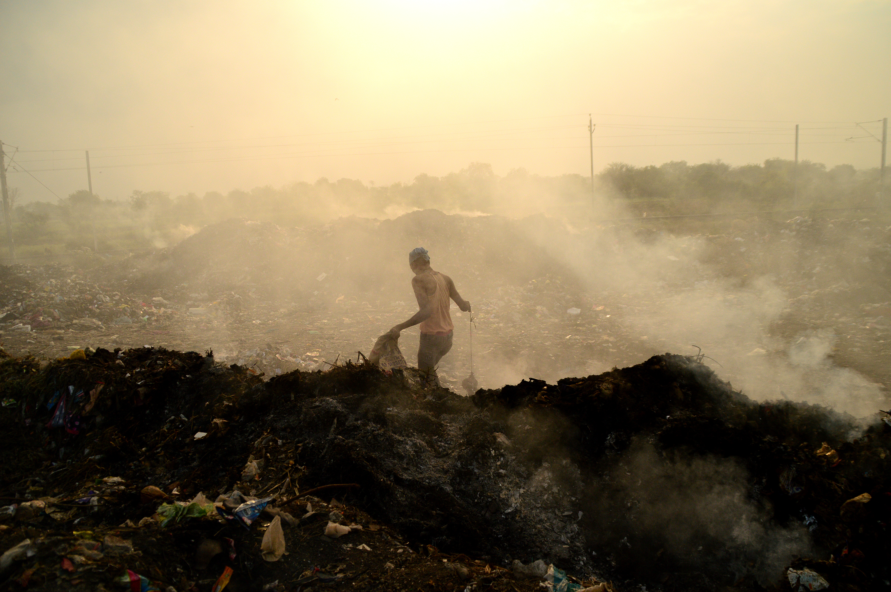 Land and air pollution in Amravati, India, purchased from Shutterstock. 