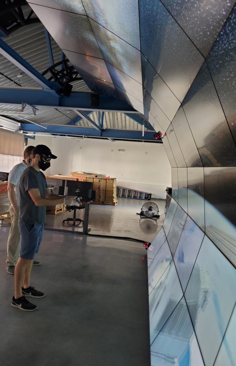 Carnegie theoretical astrophysicist Anthony Piro testing the VizLab on the day construction was completed. Image courtesy of the Carnegie Institution for Science. 