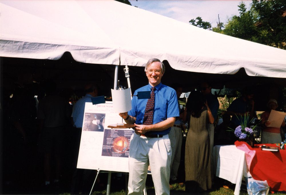 Sean Solomon with a model of the MESSENGER craft, 1999