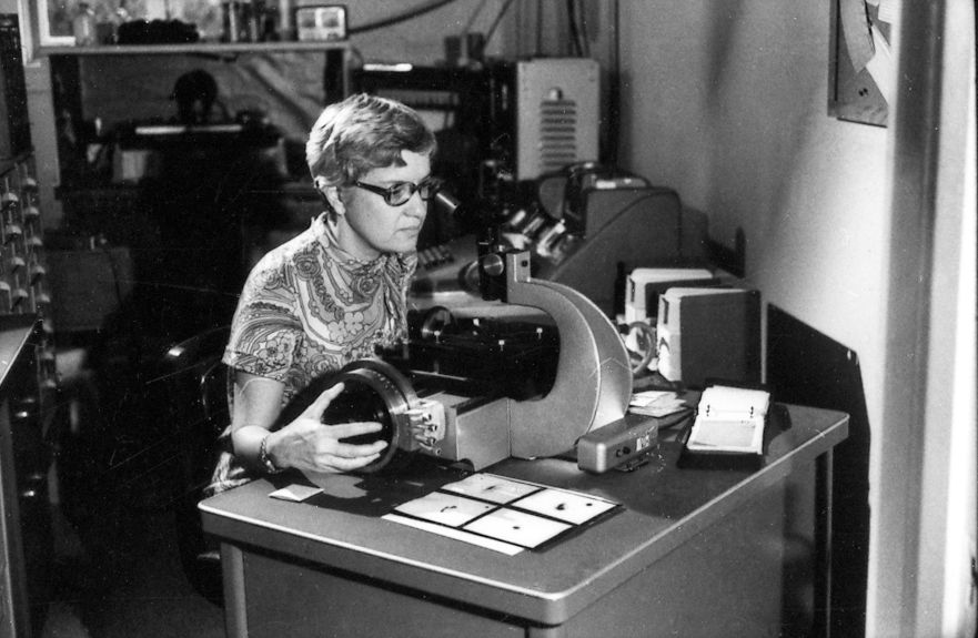 Astronomer Vera Rubin at her “measuring engine” used to examine photographic plates.