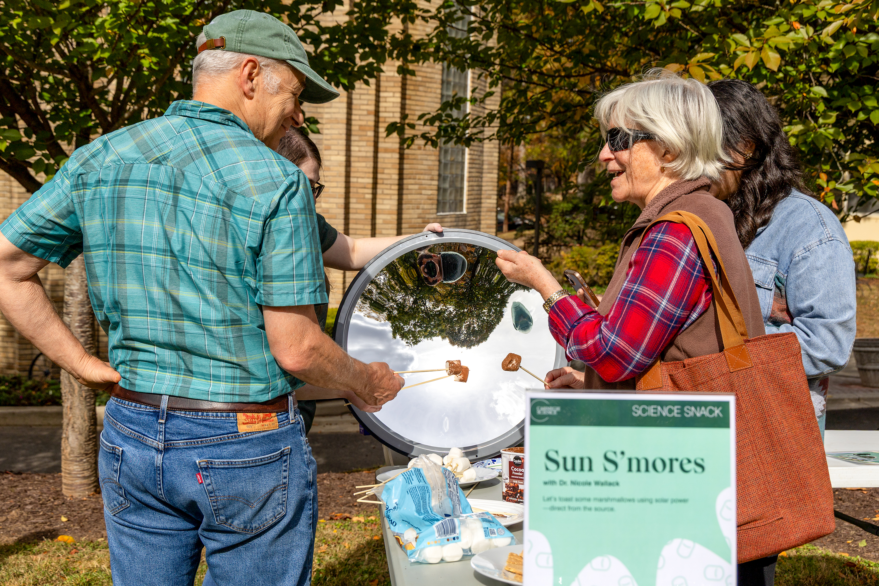 Earth & Planets Laboratory Attendees learn how to make smores using the sun