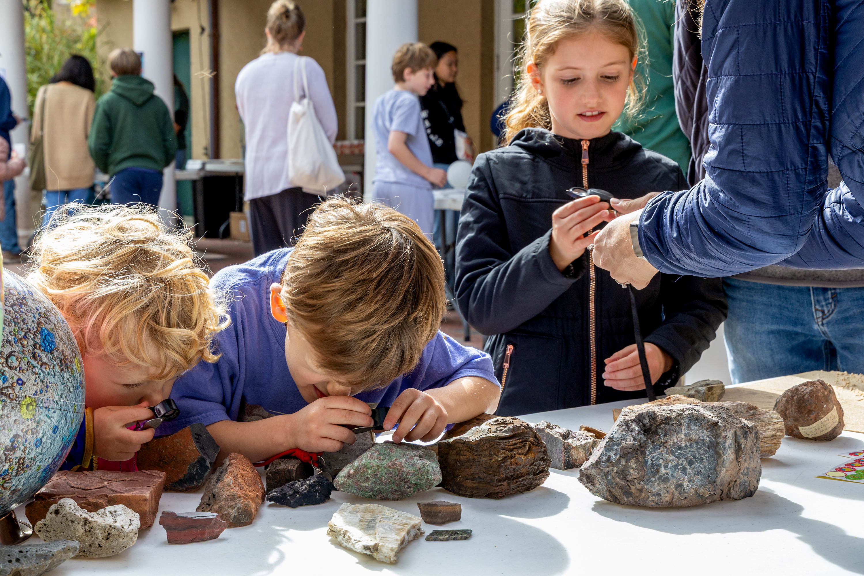 Children learn about rocks at the Earth & Planets Laboratory Open House