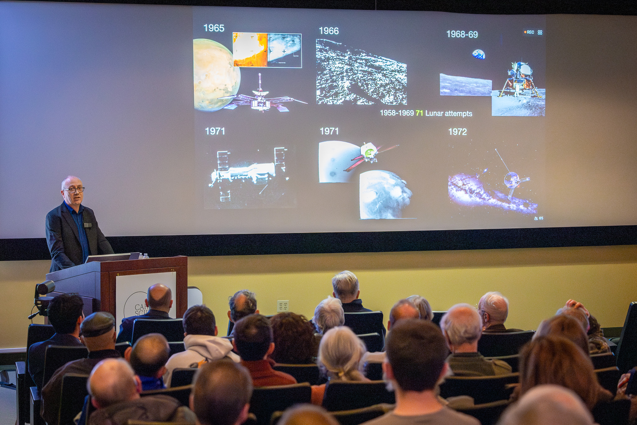 Caleb Scharf speaks to a room full of science enthusiasts during the Earth and Planets Laboratory Neighborhood Lecture