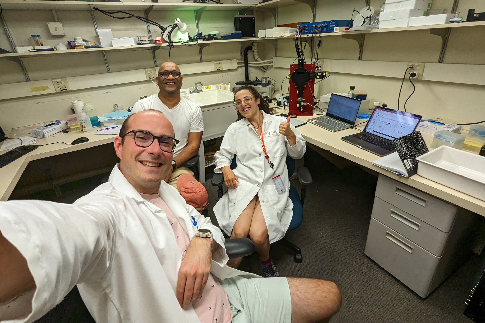 Burlacot with former postdoctoral researchers in the lab