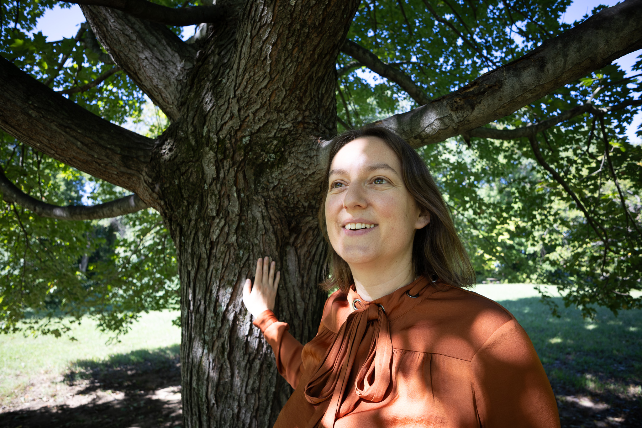 Marion Le Voyer touches a tree