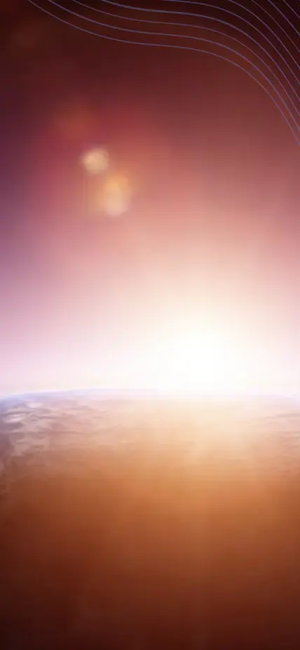 A star rises behind a planet, illuminating the planet's atmosphere. 