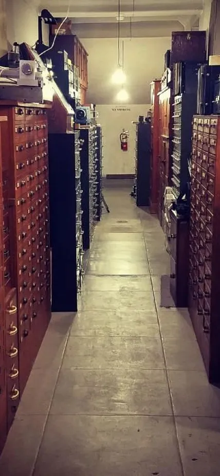 Photo of a hallway with tall file cabinets going all the way down on both sides
