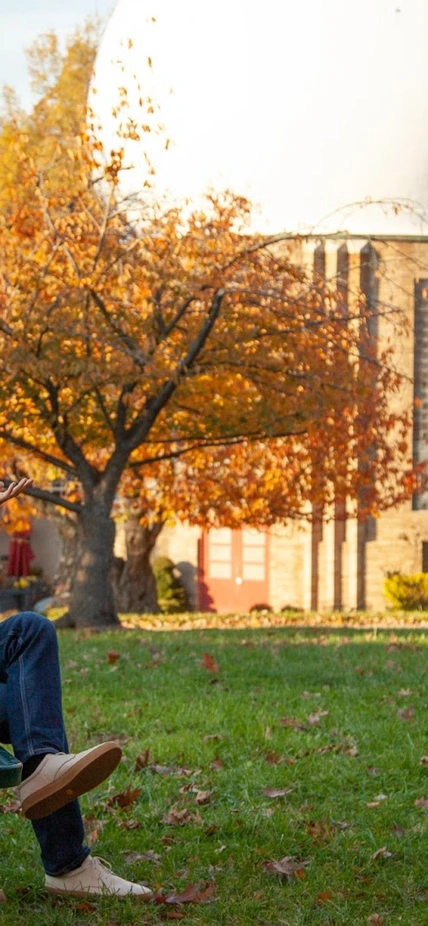 Mike Wong poses in front of the campus’ iconic Atomic Physics Observatory. 