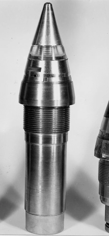 A proximity fuze at the left compared with a clockwork fuze at right