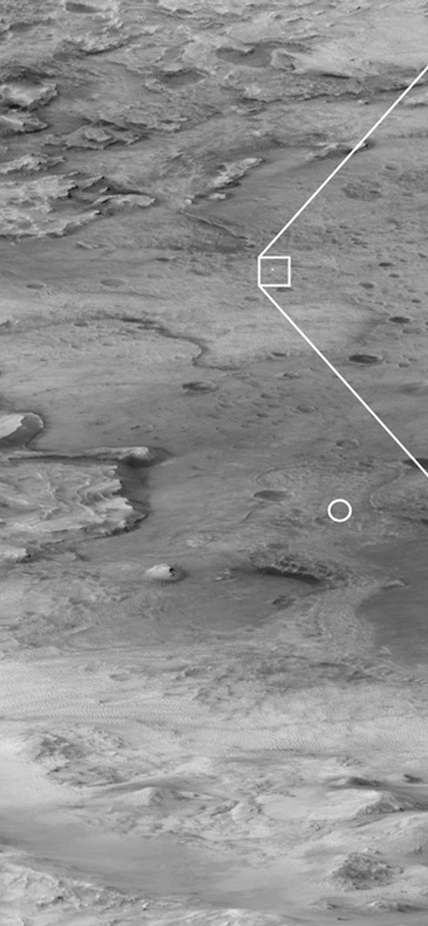 Hanging from a parachute about the Martian landscape, NASA’s Perseverance rover can be seen falling through the Martian atmosphere. Courtesy of NASA/JPL. 