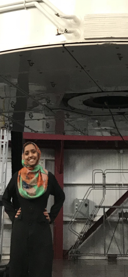 Munazza Alam stands in front of the Magellan Clay telescope at Carnegie's Las Campanas Observatory. Image courtesy Munazza Alam.