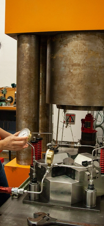 Kara Brugman uses piston-cylinder and multi-anvil presses, like the one seen here, to bring her samples to the temperatures and pressures they would experience inside of a developing planet.