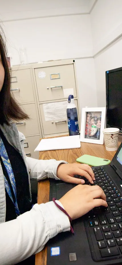 Tiange Bi studies materials on her computer