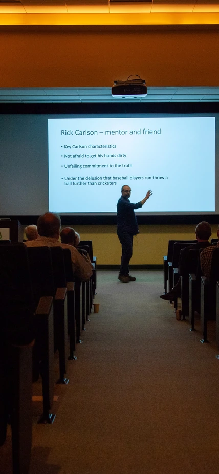 Graham Pearson in front of slide