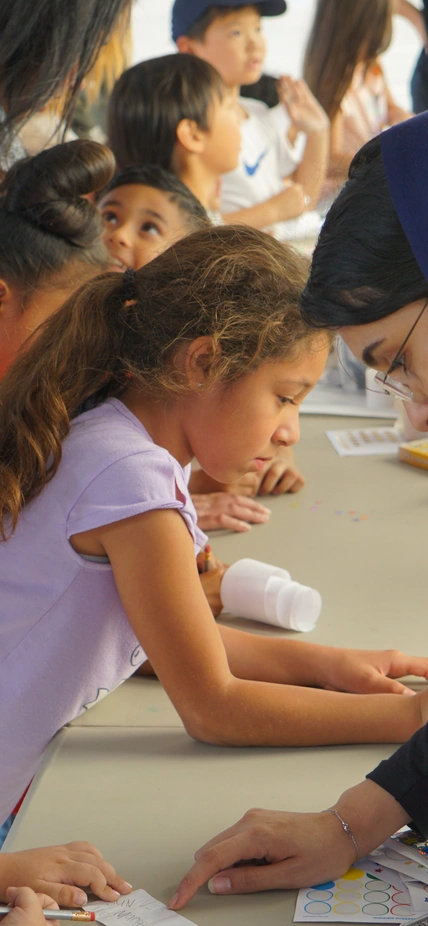 Young Open House attendees participate in an activity