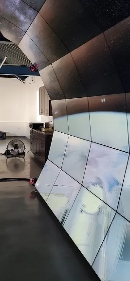 Carnegie theoretical astrophysicist Anthony Piro engages with a 3-D rendering of the International Space Station on the VizLab’s wall.