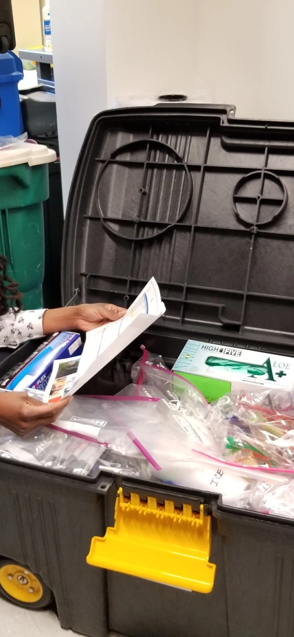 Reviewing supplies for the Amgen Biotech Experience