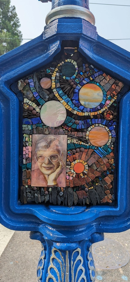 Call Box Art - Brightly colored mosaic with space themes and a portrait of Vera Rubin
