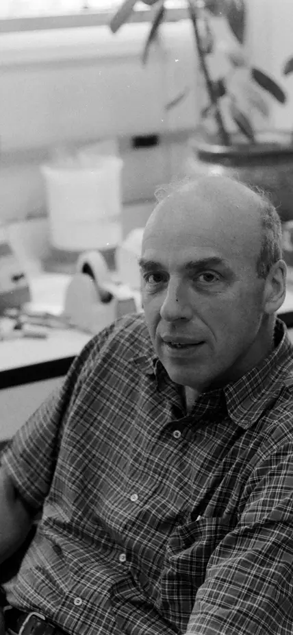 Donald Brown seated in the lab in Baltimore. Black and white photo. 