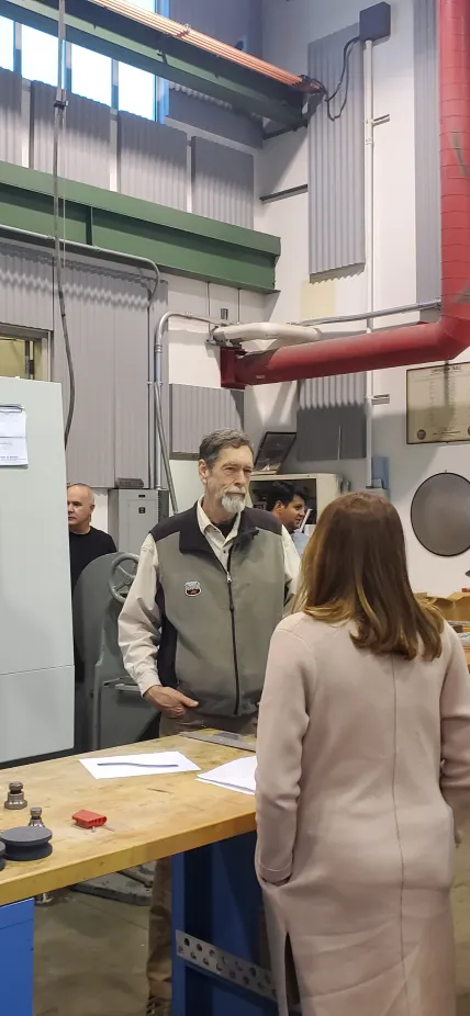 A tour group visits the Observatories machine shop