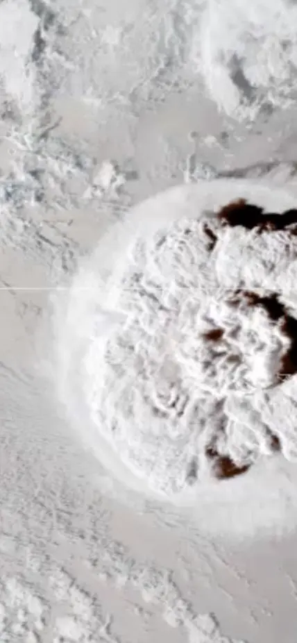 Still shot from a looping video showing an umbrella cloud generated by the underwater eruption of the Hunga Tonga-Hunga Ha’apai volcano on Jan. 15, 2022. The GOES-17 satellite captured the series of images that also show crescent-shaped shock waves and lightning strikes. Credit: NASA Earth Observatory image by Joshua Stevens using GOES imagery courtesy of NOAA and NESDIS.