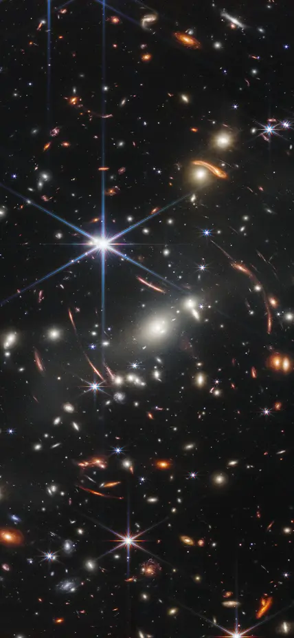 Thousands of galaxies flood this near-infrared image of galaxy cluster SMACS 0723. High-resolution imaging from NASA’s James Webb Space Telescope combined with a natural effect known as gravitational lensing made this finely detailed image possible. Credit: NASA, ESA, CSA, STScI