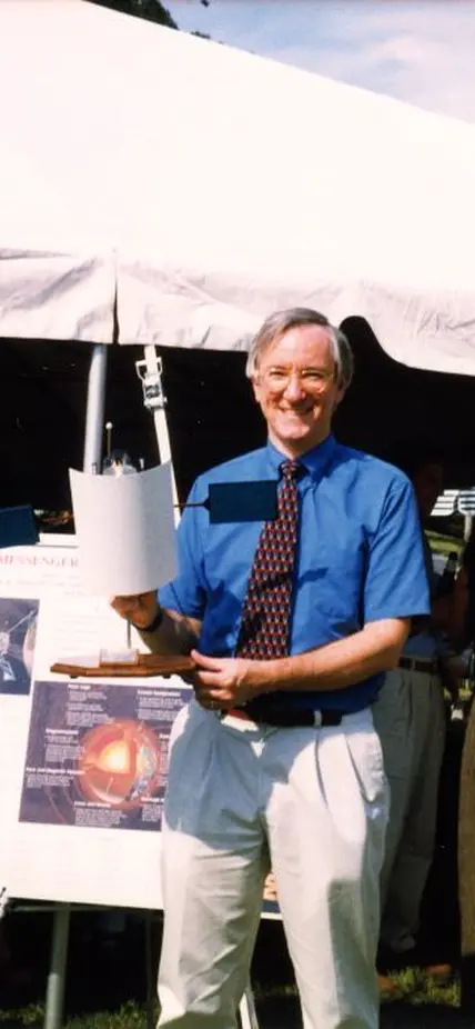 Sean Solomon with a model of the MESSENGER craft, 1999