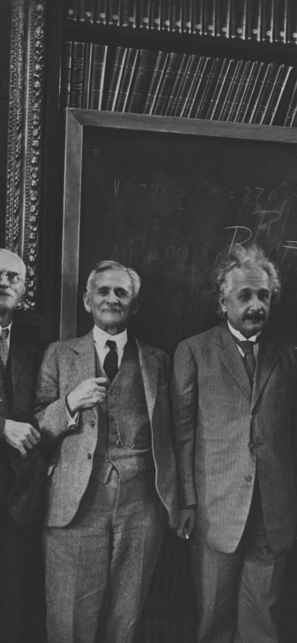 Legendary astronomers and physicists, including Albert Einstein, gather in the library at the Carnegie Science Observatories