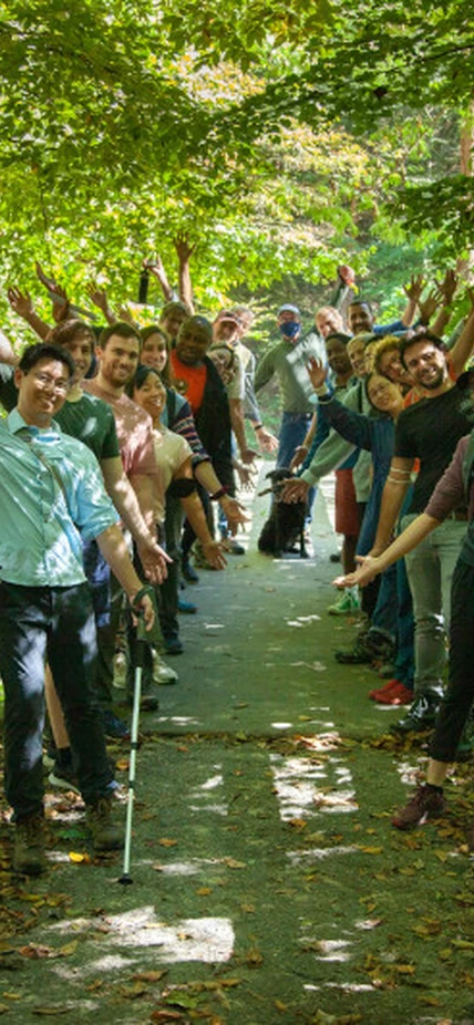 Postdocs pose on a bridge in Rock Creek PArk
