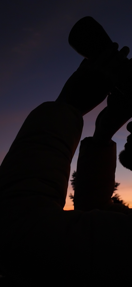 Stargazing with binoculars at sunset
