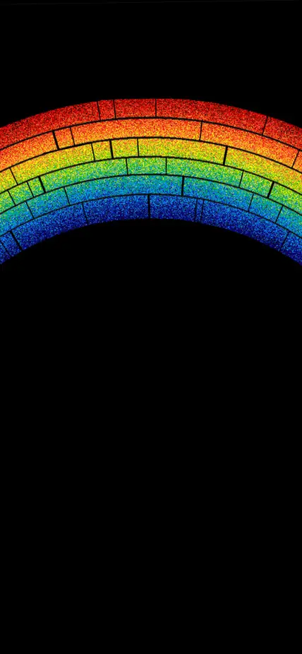 A rainbow arc against a black background. 