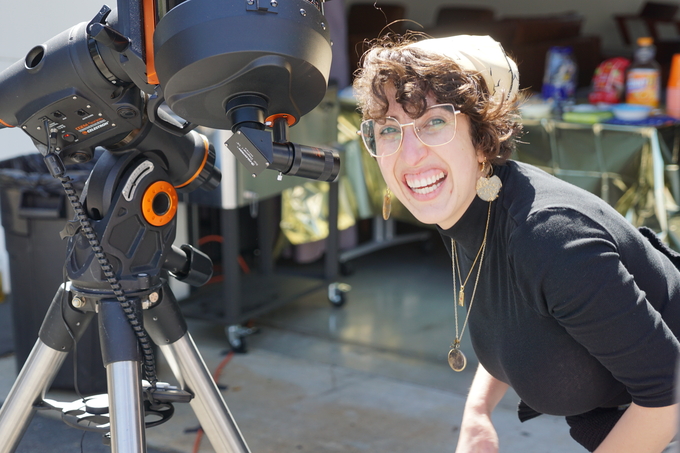 Natalie "Nicole" Sanchez viewing the partial solar eclipse at the Observatories