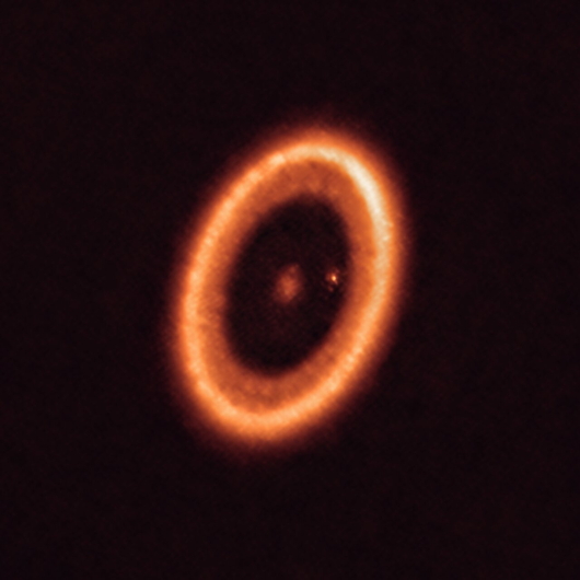 ALMA Observatory data shows a young star, PDS-70, surrounded by a dusty disk where new planets are forming. 