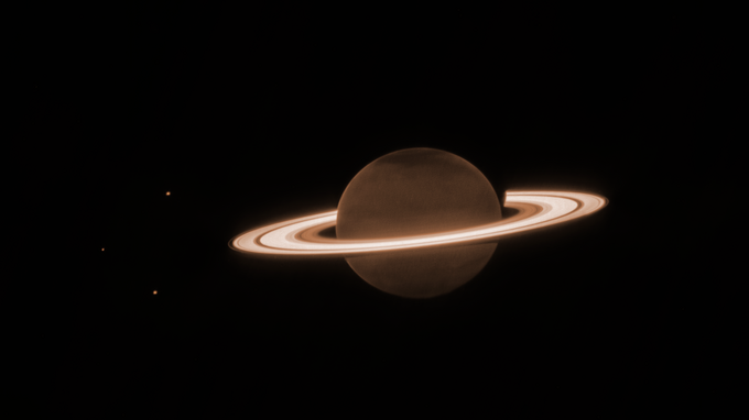 Description: In this James Webb Space Telescope infrared image, Saturn’s atmosphere appears unusually dark because methane absorbs most of the sunlight. In contrast, the icy rings shine brightly, standing out in sharp relief against the dim planet.  Credit: NASA, ESA, CSA, Webb Saturn Team; image processing by Joseph DePasquale (STScI)