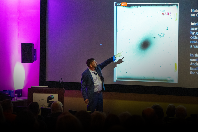 John Mulchaey Points to Var! Plate at Neighborhood Lecture Series -