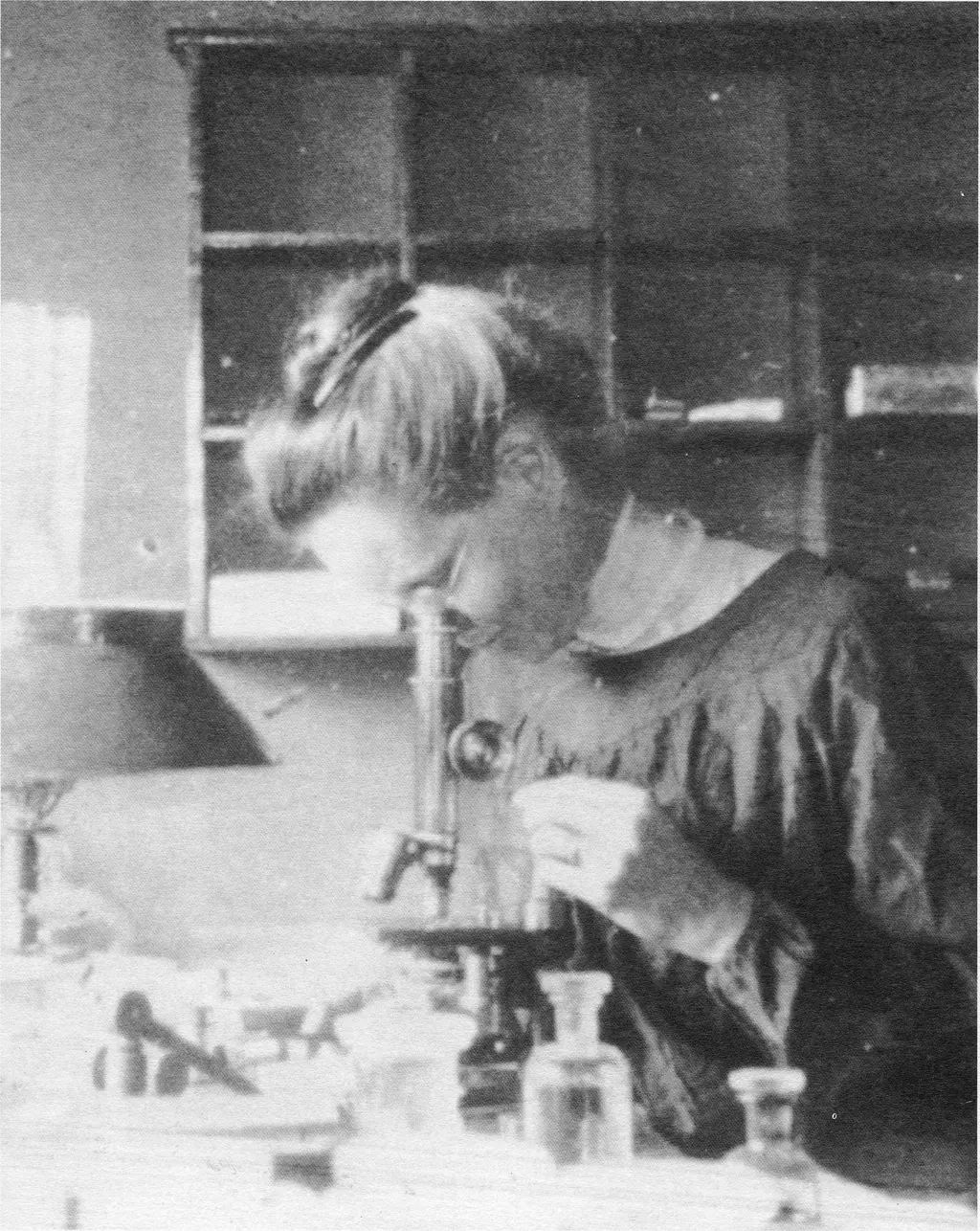 Nettie Marie Stevens is shown here looking through a microscope while studying at the Stazione Zoologica in Naples, Italy. 