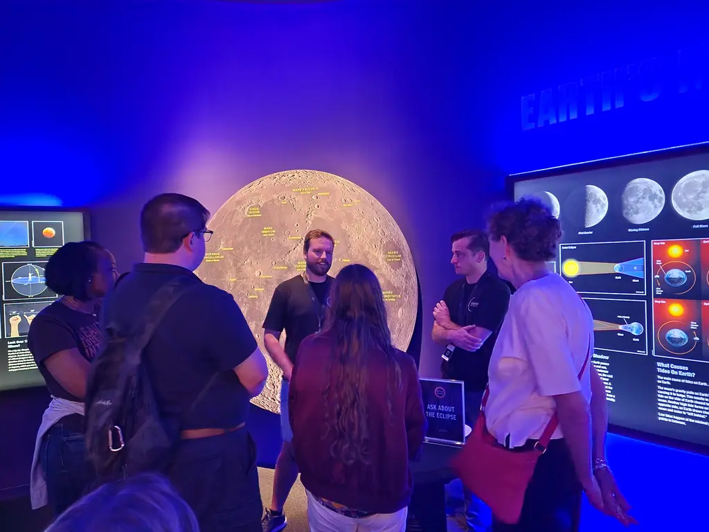 Carnegie Science volunteers at the Perot Museum answering questions about the eclipse