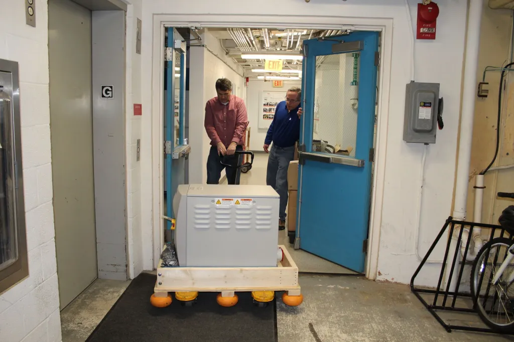 Carnegie scientists set up DTM's new mass spectrometer at Broad Branch Road