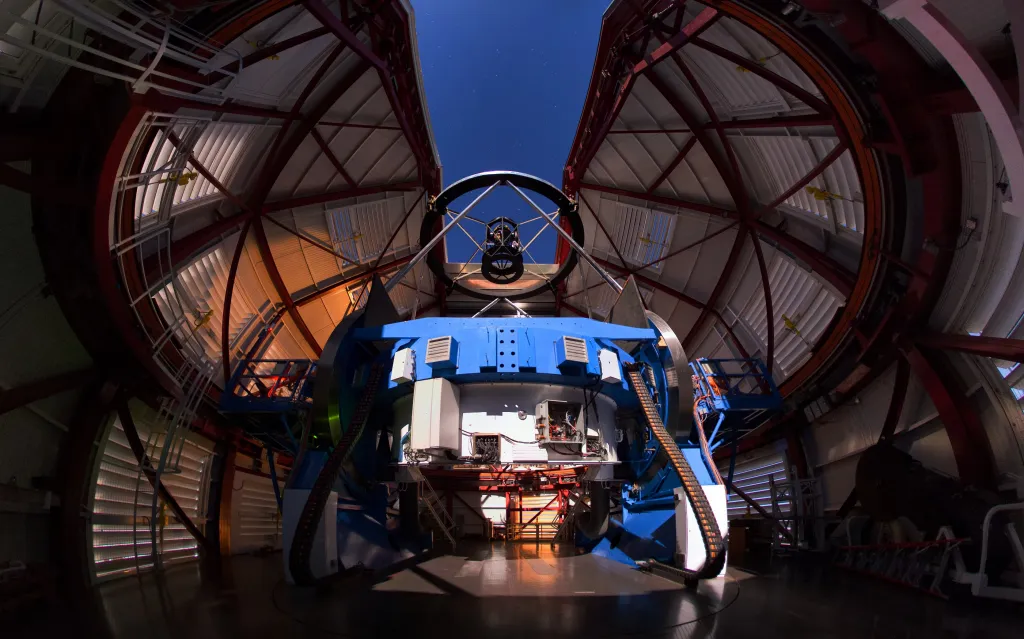 The Magellan Telescope with Magellan Adaptive Optics' Adaptive Secondary Mirror mounted at the top, looking down the on 6.5-meter (21 foot) diameter Primary Mirror. Courtesy Yuri Beletsky. 