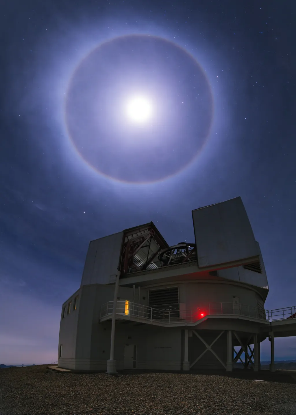 The moon with a cloudy halo over the Magellan Clay telescope at Carnegie Science's Las Campanas Observatory. Courtesy Yuri Beletsky