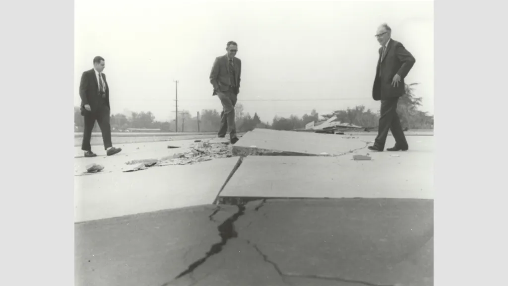 Charles Richter (right) and others viewing buckled pavement. Credit: Caltech Archives 