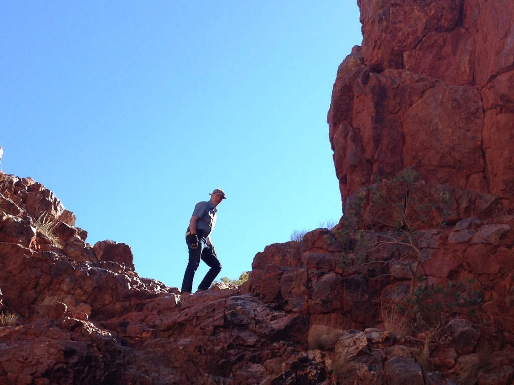 Bob Hazen hiking in the field.