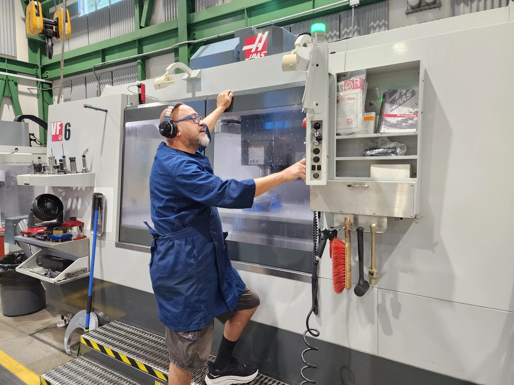 Instrument Maker and CNC Machinist Jerson Castillo at work in the Observatories Machine Shop. 