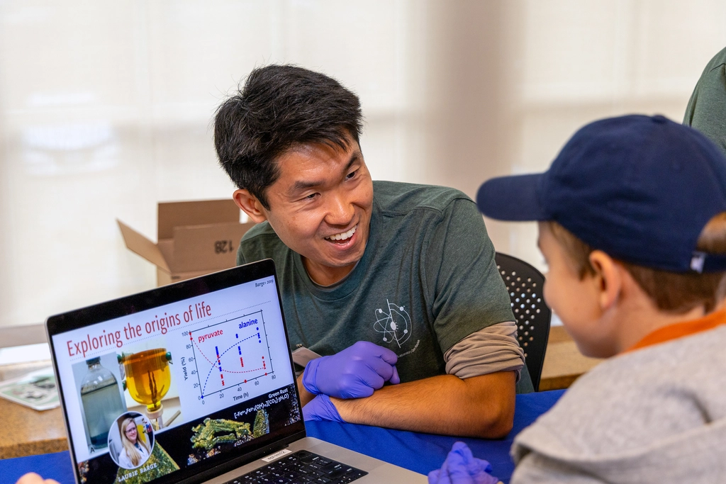 Mike Wong engages with a neighborhood child during the inaugural EPL Open House in the fall of 2025.