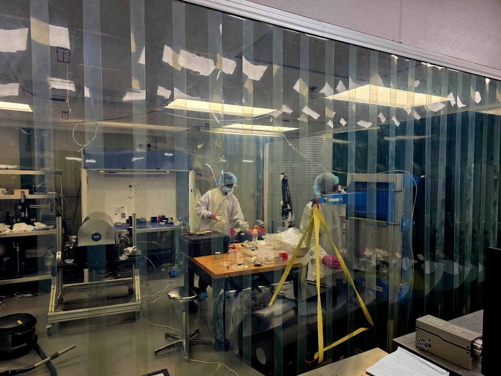Jason Williams works on the Henrietta spec clean room at the Observatories.