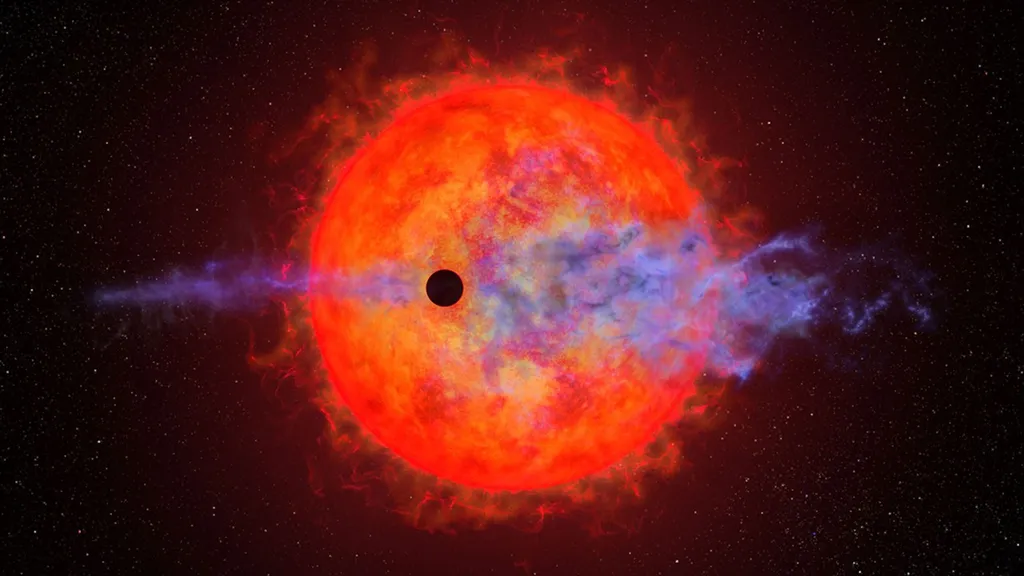 This artist's illustration shows a planet (dark silhouette) passing in front of the red dwarf star AU Microscopii. The planet is so close to the eruptive star a ferocious blast of stellar wind and blistering ultraviolet radiation is heating the planet's hydrogen atmosphere, causing it to escape into space. This process may eventually leave behind a rocky core. This process may eventually leave behind a rocky core. Credit: NASA, ESA, and Joseph Olmsted (STScI)