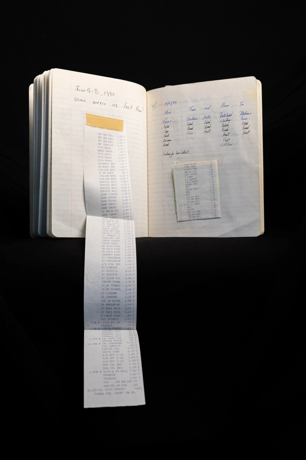 A receipt unfurls from the Lunch Club notebook. 