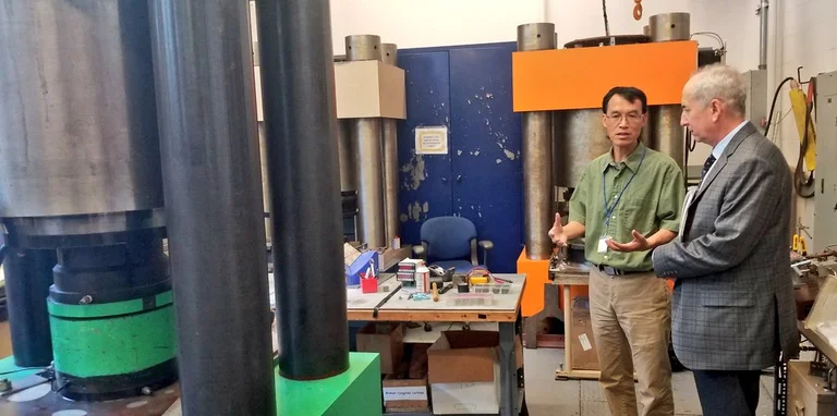 Yingwei Fei and Carnegie President Eric Isaacs in the Earth and Planets Laboratory high pressure lab