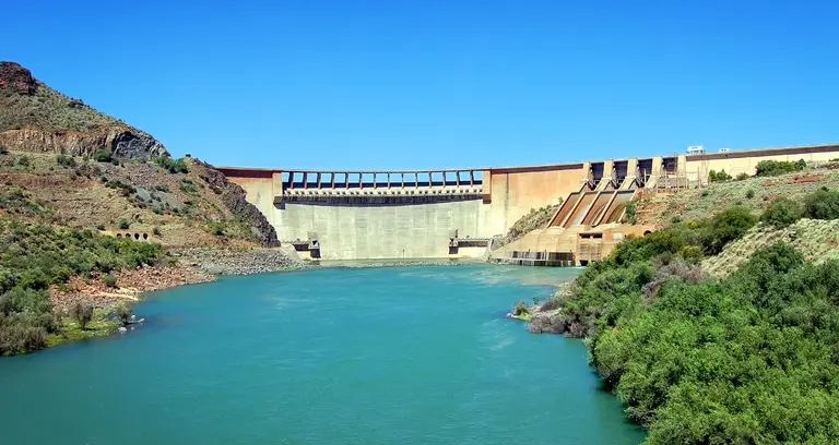 Dam in Karoo (semi desert) in South Africa. Reservoirs created by dams not only suppress floods but also provide water for irrigation, human consumption, industrial use, aquaculture.