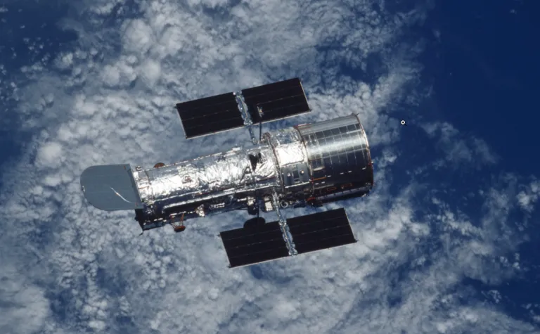 Image of the Hubble Space Telescope floating above the Earth courtesy of NASA